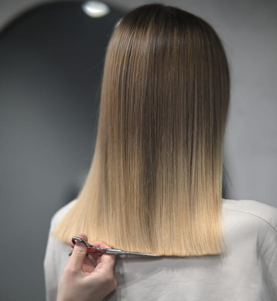 blunt cut on blonde-haired woman