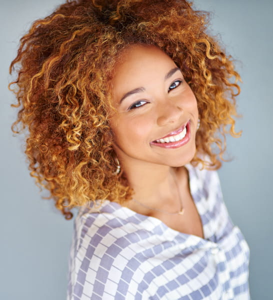 Beautiful black woman rocking wash and go curly hairstlyes
